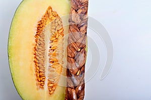 Dried melon in the form of plait on cut melons isolated on white background