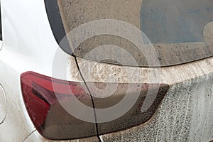 Dried mud on the rear light on a car