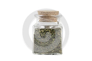 dried nettle herb or in latin Utricae folium in a glass jar isolated on white background. medicinal healing herbs. herbal medicine