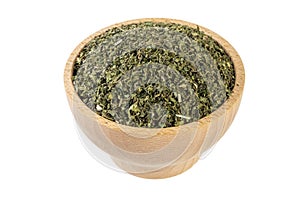 dried nettle herb or in latin Utricae folium in wooden bowl isolated on white background. medicinal healing herbs. herbal medicine