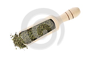 Dried nettle herb or in latin Utricae folium in wooden scoop isolated on white background. medicinal healing herbs. herbal medicin