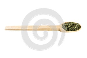 Dried nettle herb or in latin Utricae folium in wooden spoon isolated on white background. medicinal healing herbs. herbal medicin