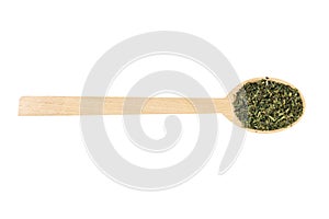 dried nettle herb or in latin Utricae folium in wooden spoon isolated on white background. medicinal healing herbs. herbal medicin