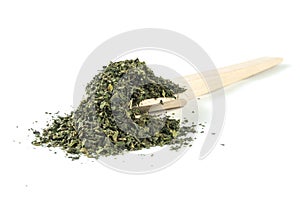 Dried nettle herb or in latin Utricae folium in wooden spoon isolated on white background. medicinal healing herbs. herbal medicin