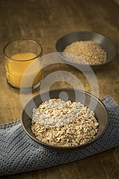 Dried oats and orange juice photo