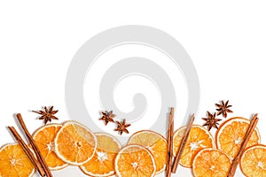 dried orange slices star anise and cinnamon sticks on a white background