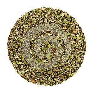 Dried oregano, herb circle from above, over white