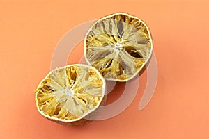 Dried out inedible oranges on plate