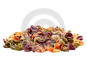 Dried pasta in mixed front view. Colorful vegetable pastas on background