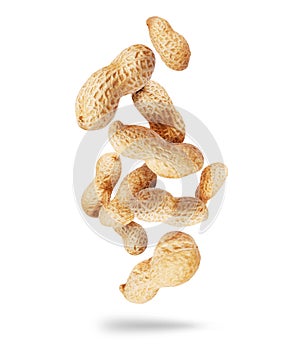 Dried peanuts close-up in the air isolated on a white background