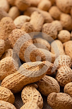 Dried peanuts in close-up. Peanut food background