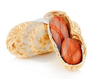 Dried peanuts close-up on a white background.