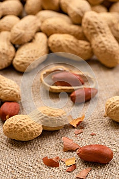 Dried peanuts close-up. Whole nuts and shelled kernels