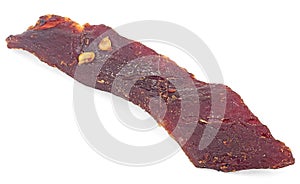Dried peppered beef jerky piece isolated on white background