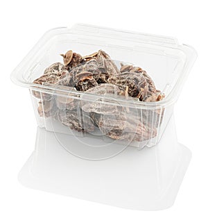 Dried persimmon in a plastic food container