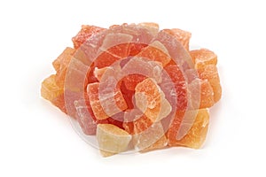 Dried pieces of papaya, close-up, isolated on white background