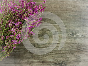 Dried pink,purple flowers on wooden background