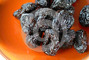 Dried pitted plums photo