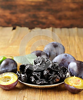 Dried plums prunes and fresh berries