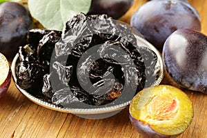 Dried plums prunes and fresh berries