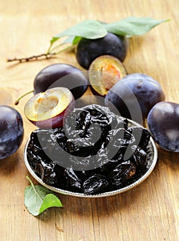 Dried plums prunes and fresh berries