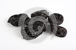 Dried plums prunes on white background
