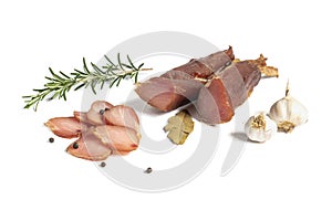 Dried pork meat smoked on traditional way with garlic , rosemary and pepper isolated on white background