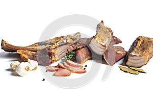 Dried pork meat smoked on traditional way with garlic , rosemary and pepper isolated on white background