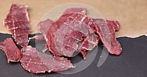 dried pork meat with spices and salt on the table