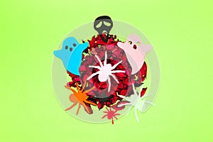 dried potpourri with colorful spiders and ghosts, creative halloween concept, flat lay, paper craft