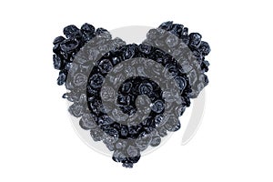 Dried prunes in the shape of  heart. White background