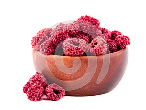 Dried raspberry isolated on white background. Dehydrated raspberry in wooden bowl