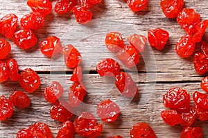 Dried red cherry close up on an old table, top view