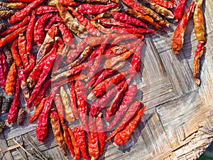 Dried red chili or chili cayenne pepper on bamboo tray