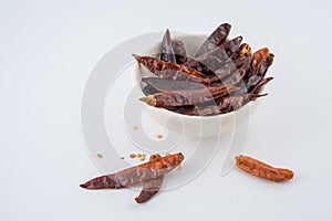 Dried red chili or chilli cayenne pepper isolated on white background , red dried chili, food ingredient for spicy cooking