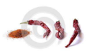 Dried red chili pepper on white background. Desiccated milled paprika.