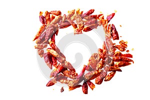dried red chili peppers in a heart shape isolated on a white background, love concept and heart health
