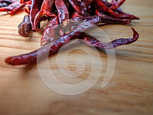 Dried red chili peppers on slate background. Ingredient for thai food on wood table background