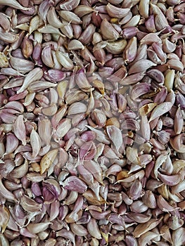 Dried red chilli, stacked together in large numbers.