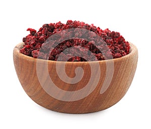 Dried red currants in wooden bowl isolated on white