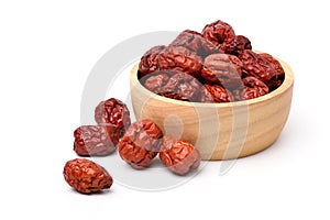 Dried red date or Chinese jujube fruits in wooden bowl