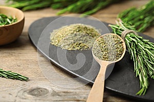 Dried rosemary and fresh twigs on table