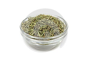 Dried rosemary in a glass cup