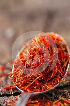 Dried saffron spice in a spoon