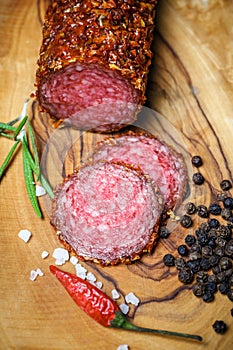 Dried salami crusted in ground red pepper