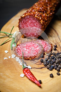 Dried salami crusted in ground red pepper