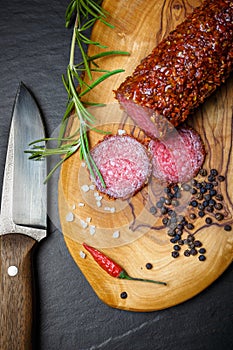 Dried salami crusted in ground red pepper