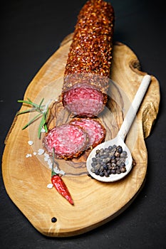 Dried salami crusted in ground red pepper