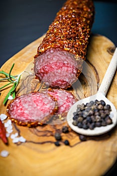 Dried salami crusted in ground red pepper