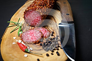 Dried salami crusted in ground red pepper